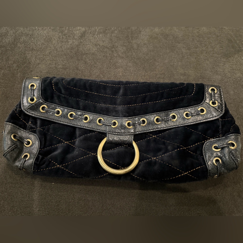 Trina Turk’s Black Quilted Clutch with Gold Accents